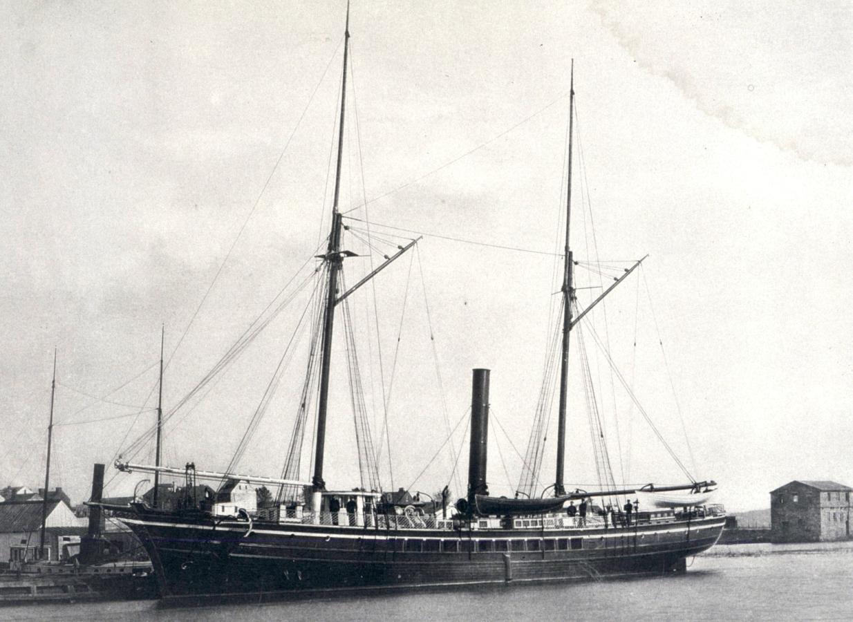 A black and white photo of the Coast and Geodetic Survey steamer BLAKE at a dock