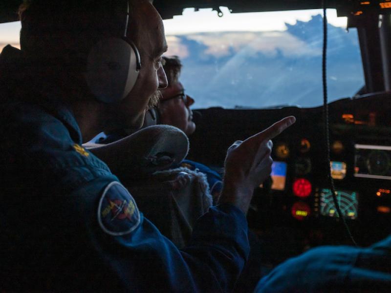 Pilots on the flight deck of a NOAA WP-3D Orion hurricane hunter aircraft