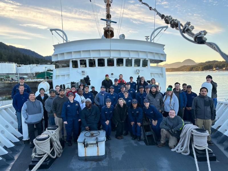 The crew of NOAA Ship Fairweather is pictured on the bow as the vessel arrives at it's new homeport in Ketchikan, AK for the first time.