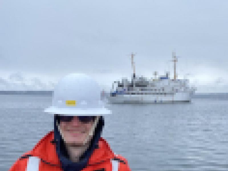 Garret Mayer with NOAA Ship Fairweather in the background. 