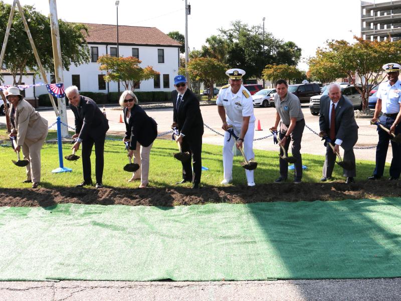 A group of people with shovels break ground on a new pier facility in Charleston, South Carolina