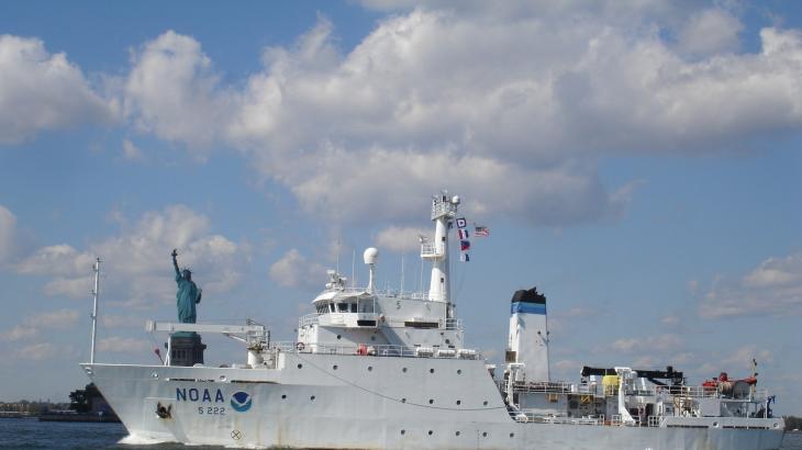 NOAA Ship Thomas Jefferson pictured with the Statue of Liberty