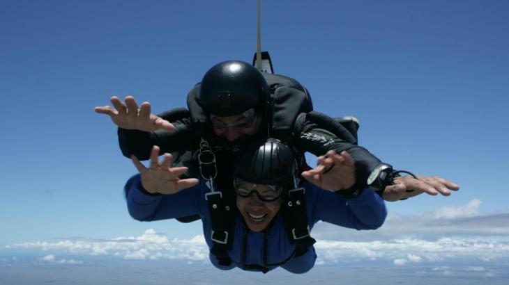 Two skydivers falling through the sky