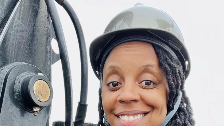 A woman in a hard hat aboard a NOAA ship