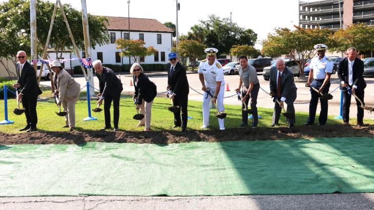 A group of people with shovels break ground on a new pier facility in Charleston, South Carolina