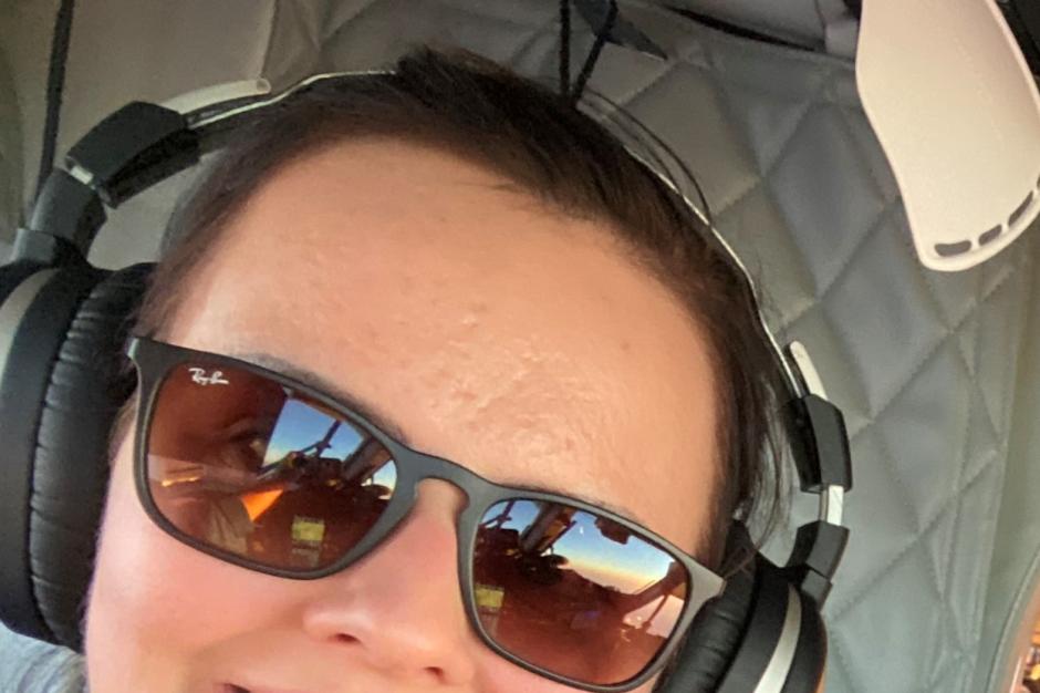 A female NOAA Corps pilot on the flight deck of a Twin Otter aircraft