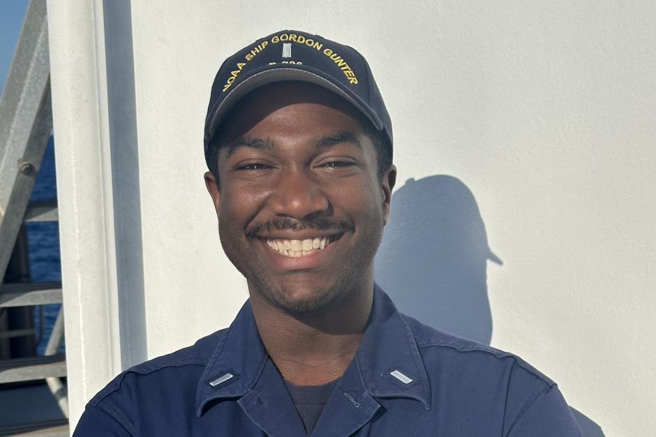 A male NOAA Corps officer on the deck of a NOAA ship