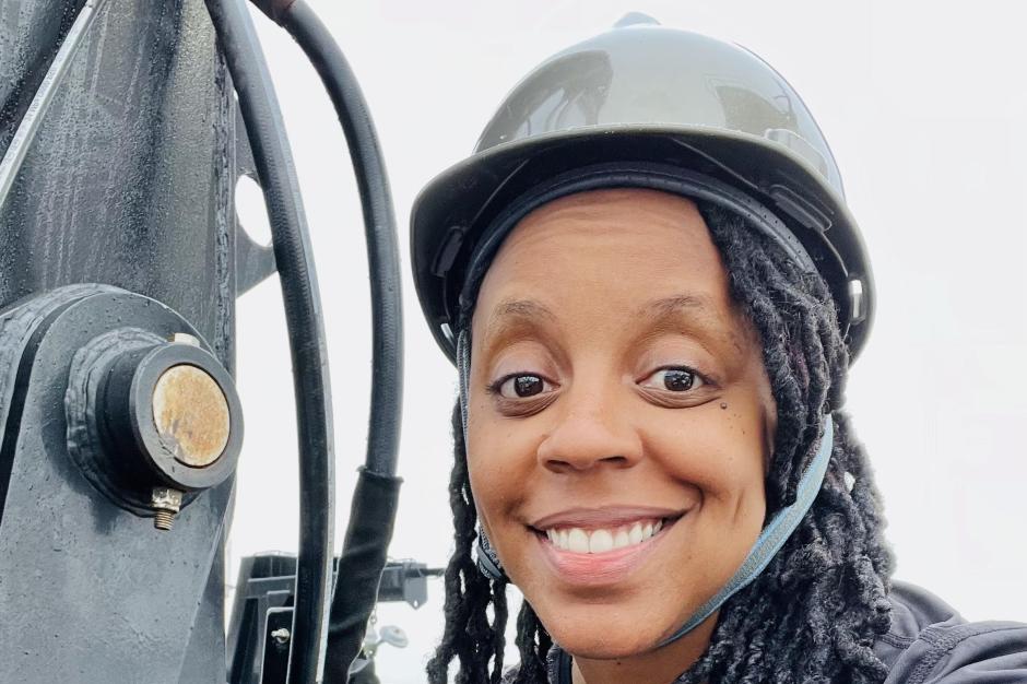 A woman in a hard hat aboard a NOAA ship