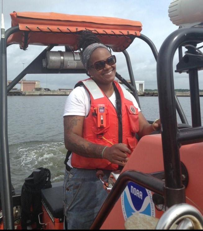 A NOAA boatswain on a small boat.