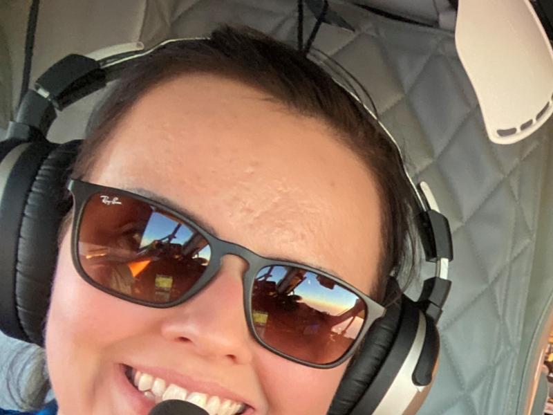 A female NOAA Corps pilot on the flight deck of a Twin Otter aircraft