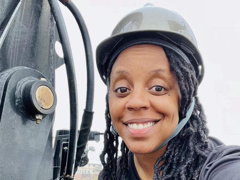 A woman in a hard hat aboard a NOAA ship