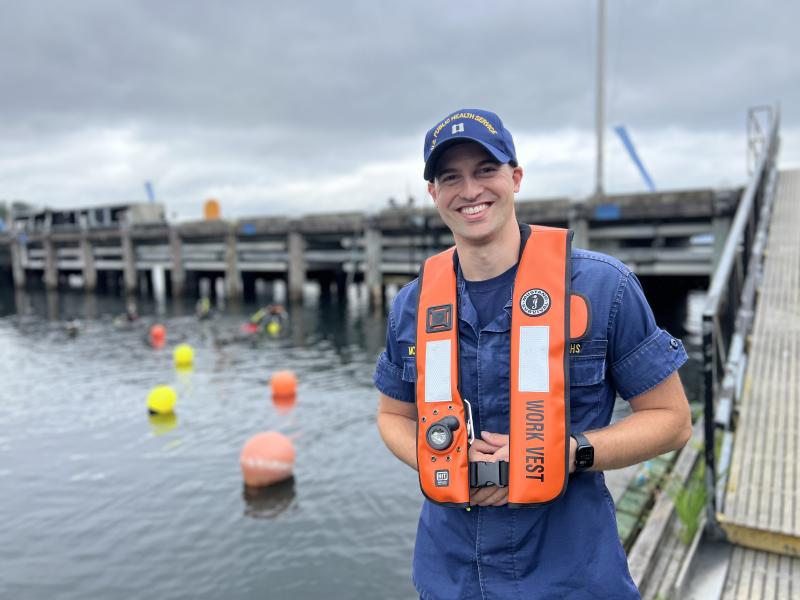 A U.S. Public Health Service Officer standing by the water during a NOAA diver training. 