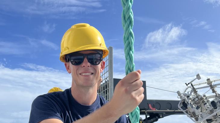 LTJG Tim Montera guiding a buoy line.