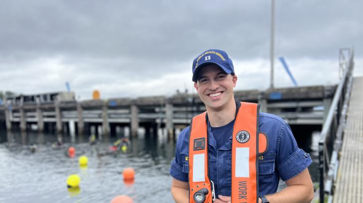 A U.S. Public Health Service Officer standing by the water during a NOAA diver training. 