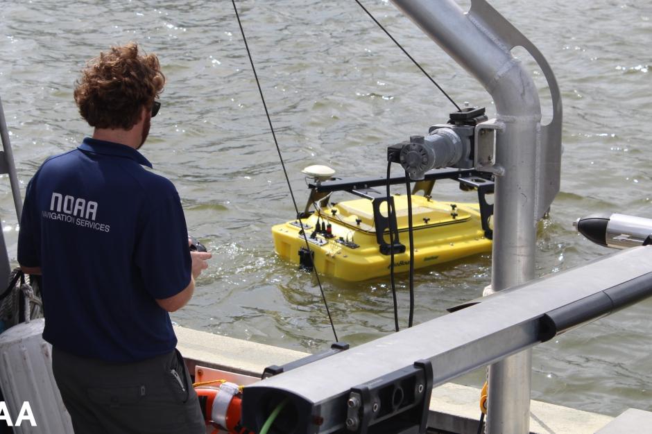 A yellow autonomous surface vehicle in the water