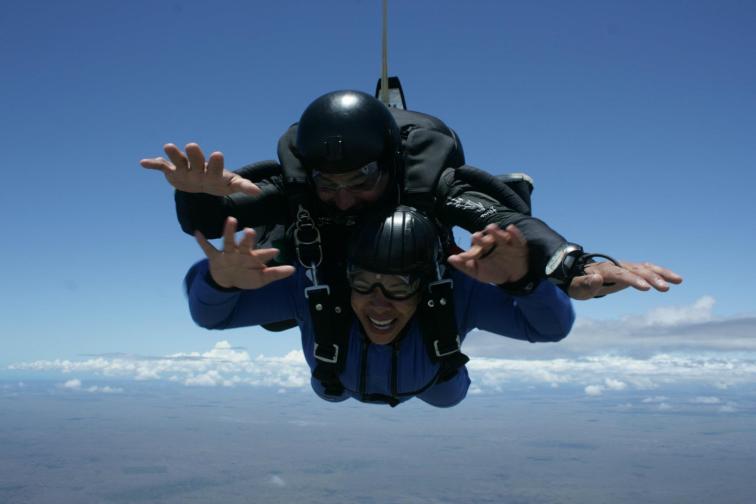 Two skydivers falling through the sky