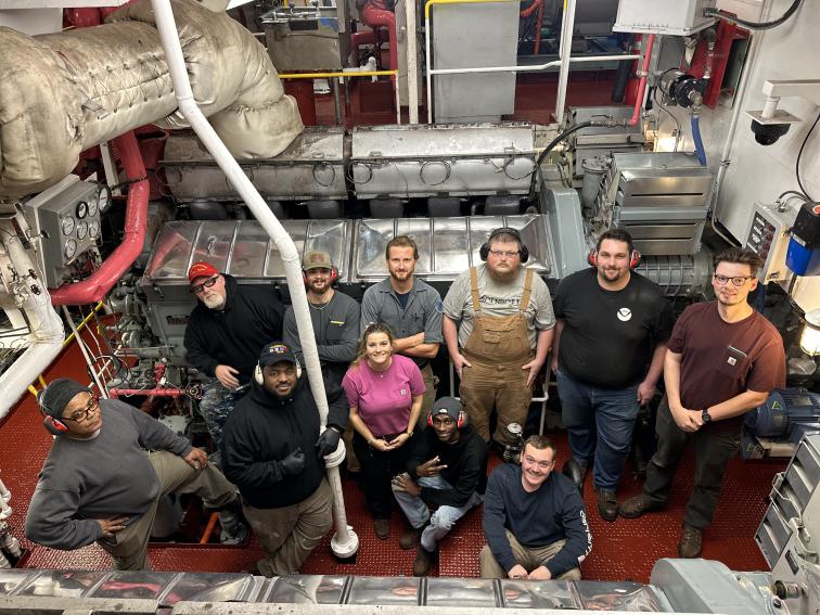 A group of people on the deck of a ship